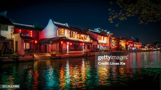 wuxi grand canal night view - lantern water stock-fotos und bilder