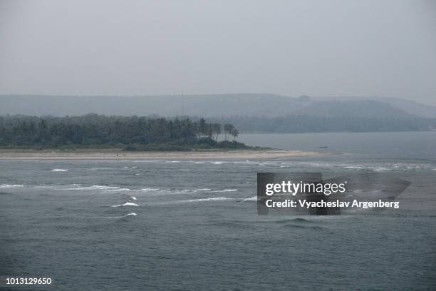 panoramic view or chapora river and arabian sea as seen from vagator fort, goa, india - chapora fort stock pictures, royalty-free photos & images