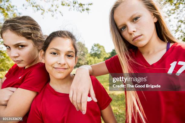 portrait of elementary aged soccer players - riot girls stockfoto's en -beelden