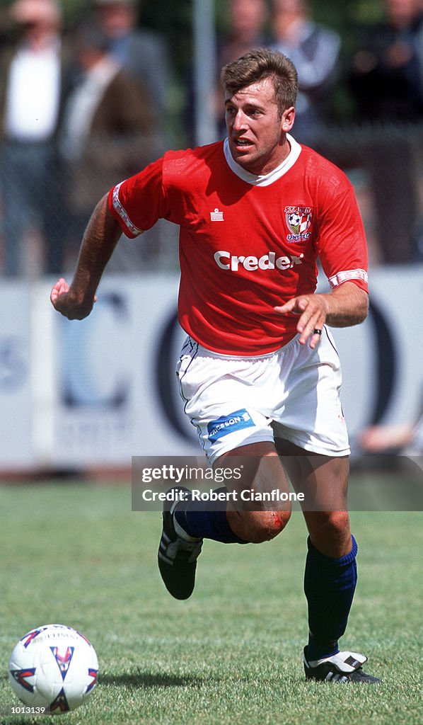 Mark Racker#3 for Sysney United looks to get the ball away,during ...