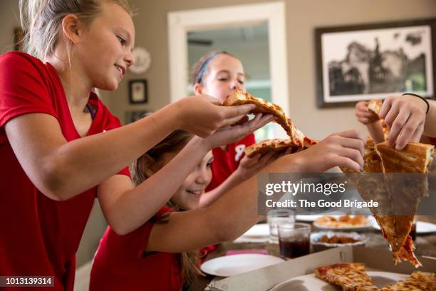 soccer team having pizza party - meal kit stock pictures, royalty-free photos & images