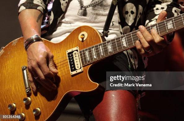 Close-up of Slash playing guitar while performing live at Paradiso on ...