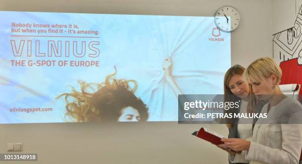 Inga Romanovskiene, director of official tourism service Go Vilnius and Indre Speciunaite public relations project manager pose in front of a...