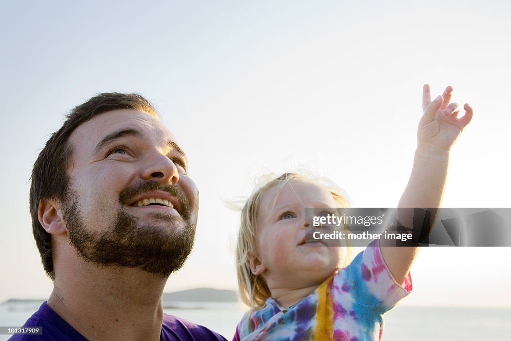 Father with toddler exploring nature