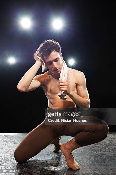 male ballet dancer (ballerino) on stage resting - ballerina ballerino fotografías e imágenes de stock