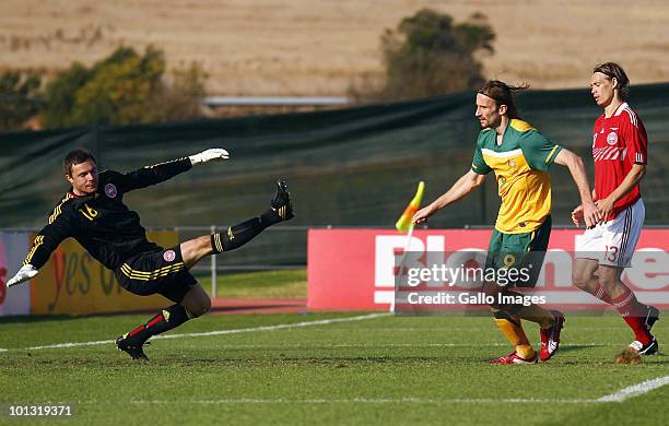 Josh Kennedy of Australia scores past Stephan Andersen of Denmark during the International Friendly between the Australian Socceroos and Denmark at...