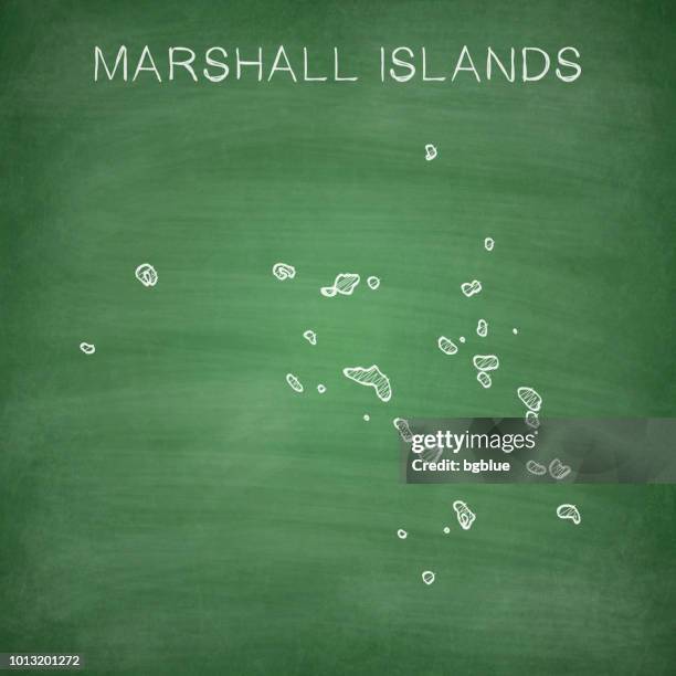 marshall islands map drawn on chalkboard - blackboard - majuro stock illustrations