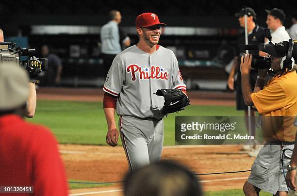 Pitcher Roy Halladay of the Philadelphia walts to be interviewed after pitching a perfect game against the Florida Marlins in Sun Life Stadium on May...