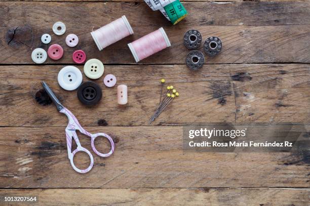 learning objects: begninner sewing kit required to get learning sew on wooden table background. directly above and copy space. - thimble stock pictures, royalty-free photos & images