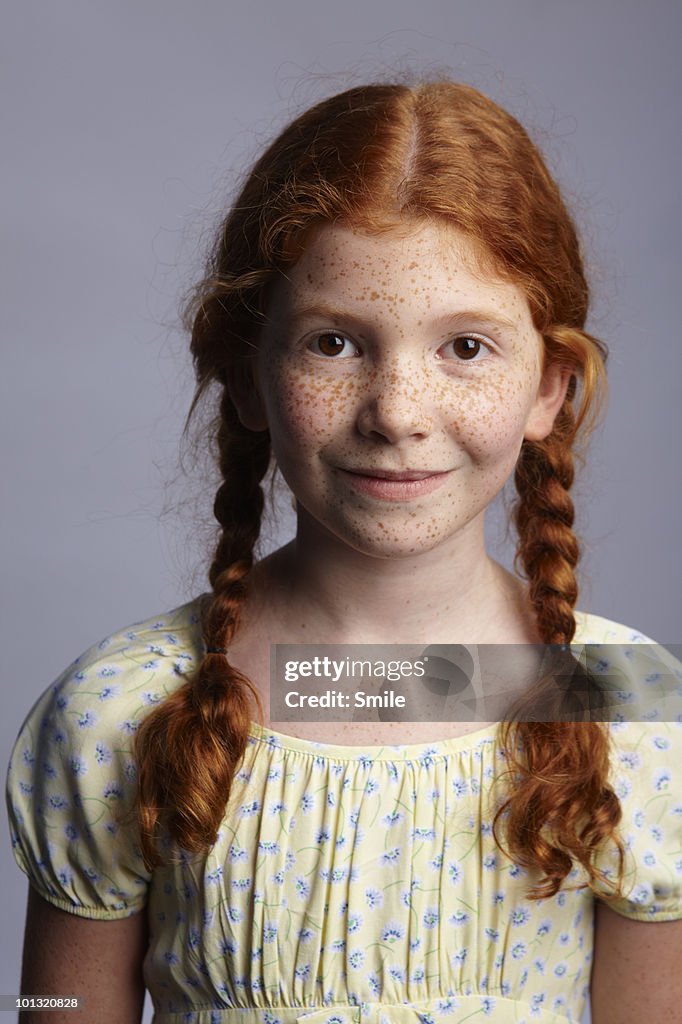 Portrait of a little redhead girl