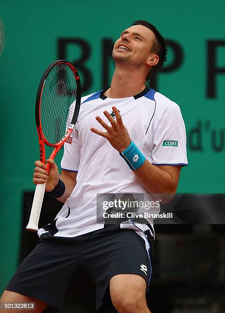 Robin Soderling of Sweden reacts during the men's singles quarter final match between Robin Soderling of Sweden and Roger Federer of Switzerland at...