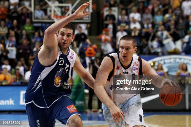 Andrew Drevo of Bremerhaven is challenged by Dragan Labovic of Frankfurt during the Beko Basketball Bundesliga play off match between Deutsche Bank...