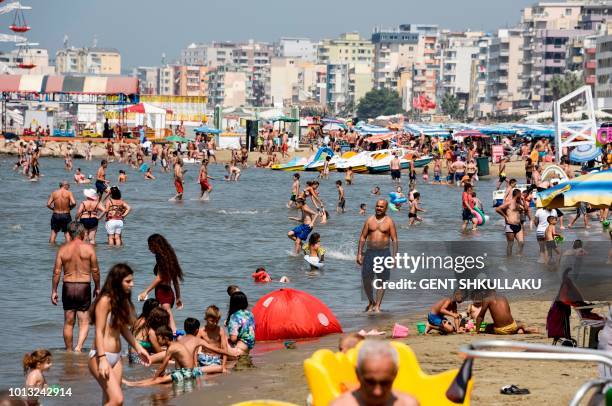 This photo taken on August 8, 2018 shows a crowded beach of the Adriatic Sea in the city of Durres, as a heatwave sweeps across Europe. -...