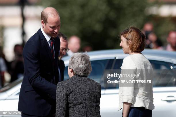 Britain's Prince William, the Duke of Cambridge, Britain's Prime Minister Theresa May , and French Minister of the Armed Forces, Florence Parly,leave...