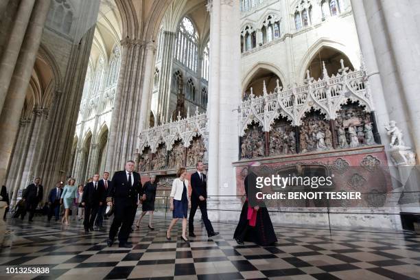Britain's Prince William, the Duke of Cambridge, and French Minister of the Armed Forces, Florence Parly, walk ahead of Britain's Prime Minister...