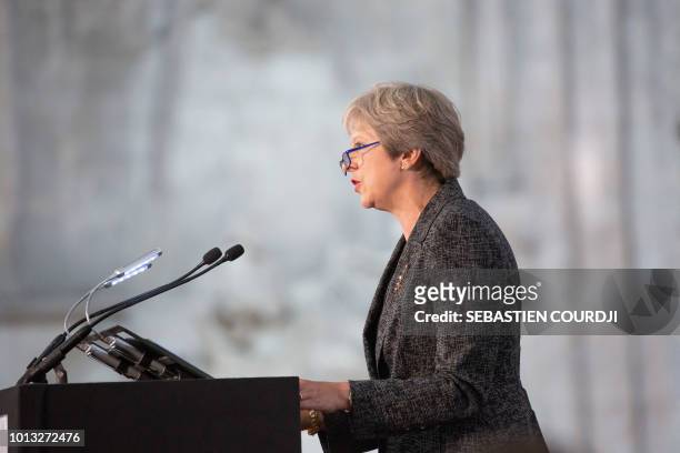 Britain's Prime minister Theresa May delivers her speech during a religious ceremony to mark the 100th anniversary of the World War I Battle of...