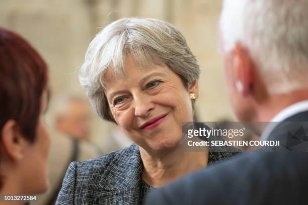 Britain's Prime minister Theresa May attends a religious ceremony to mark the 100th anniversary of the World War I Battle of Amiens, at the Cathedral...