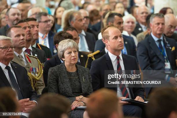 Prince William Duke of Cambridge and Britain's Prime minister Theresa May attend a religious ceremony to mark the 100th anniversary of the World War...