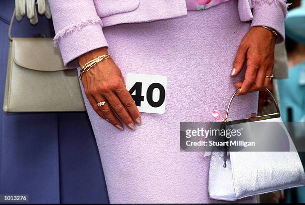 Racing fans display the latest in spring fashion, on Oaks Day, traditionally Ladies Day, held at Flemington Racecourse, Melbourne, Australia....