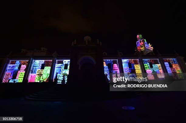 View of French artist Yves Moreaux's work "Expressions" illuminating the metropolitan Cathedral in the historical center of Quito on August 7 during...