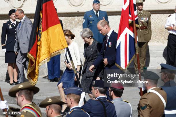 Britain's Prince William, Duke of Cambridge, Britain's Prime Minister Theresa May, and French Minister of the Armed Forces, Florence Parly, leave...