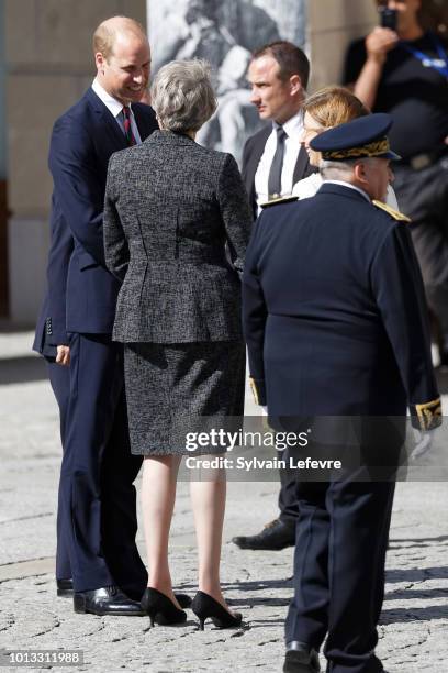 Britain's Prince William, Duke of Cambridge, Britain's Prime Minister Theresa May leave after a religious ceremony to mark the 100th anniversary of...