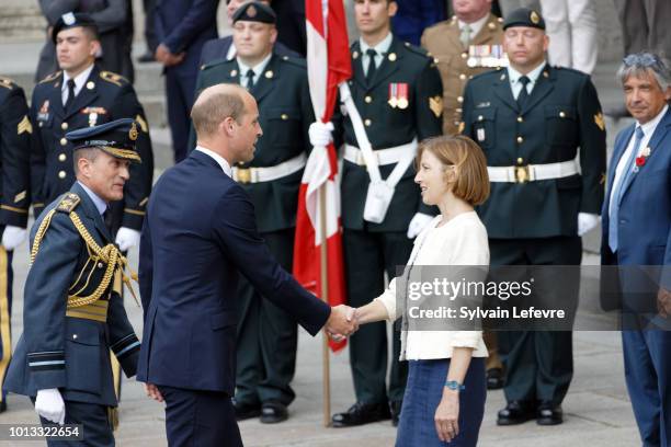 Britain's Prince William, the Duke of Cambridge, greets French Minister of the Armed Forces, Florence Parly, as Britain's Prime Minister Theresa May...