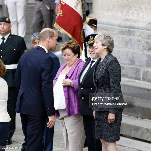 Britain's Prince William, Duke of Cambridge, greets Britain's Prime Minister Theresa May after a religious ceremony to mark the 100th anniversary of...