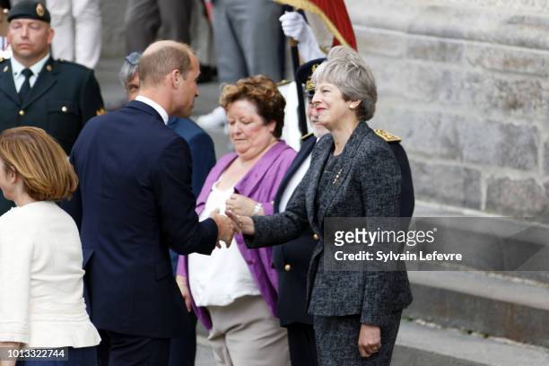 Britain's Prince William, Duke of Cambridge, greets Britain's Prime Minister Theresa May after a religious ceremony to mark the 100th anniversary of...