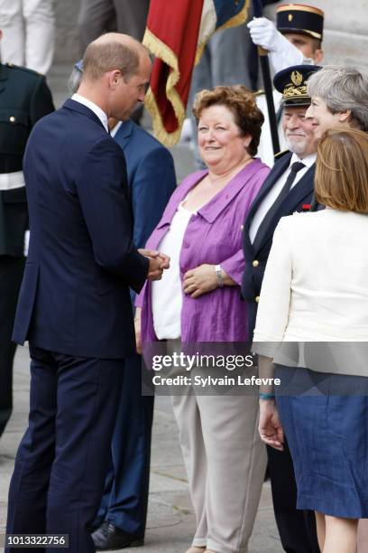 Britain's Prince William, Duke of Cambridge, greets Britain's Prime Minister Theresa May after a religious ceremony to mark the 100th anniversary of...