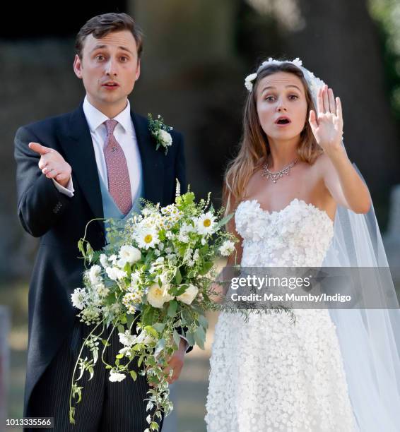 Charlie van Straubenzee and Daisy Jenks leave the church of St Mary the Virgin after their wedding on August 4, 2018 in Frensham, England. Prince...