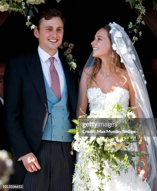 Charlie van Straubenzee and Daisy Jenks leave the church of St Mary the Virgin after their wedding on August 4, 2018 in Frensham, England. Prince...