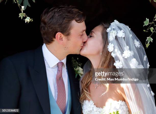 Charlie van Straubenzee and Daisy Jenks kiss as they leave the church of St Mary the Virgin after their wedding on August 4, 2018 in Frensham,...