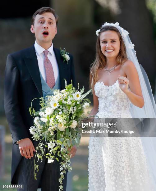 Charlie van Straubenzee and Daisy Jenks leave the church of St Mary the Virgin after their wedding on August 4, 2018 in Frensham, England. Prince...