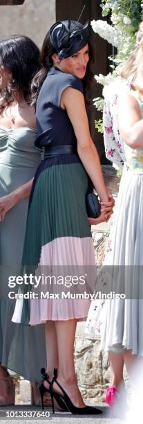 Meghan, Duchess of Sussex attends the wedding of Charlie van Straubenzee and Daisy Jenks at the church of St Mary the Virgin on August 4, 2018 in...