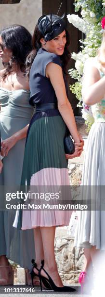 Meghan, Duchess of Sussex attends the wedding of Charlie van Straubenzee and Daisy Jenks at the church of St Mary the Virgin on August 4, 2018 in...