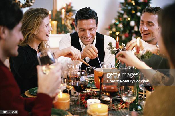 friends, dinner, christmas, home, fondue - fondue stock-fotos und bilder