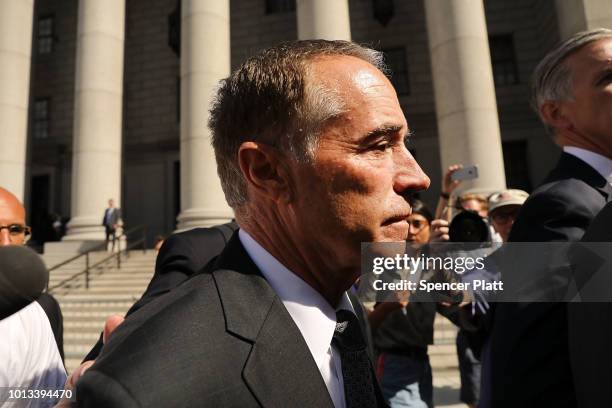 Rep. Chris Collins walks out of a New York court house after being charged with insider trading on August 8, 2018 in New York City. Federal...