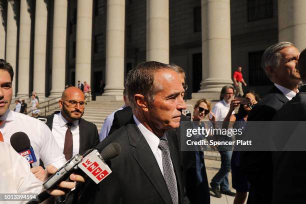 Rep. Chris Collins walks out of a New York court house after being charged with insider trading on August 8, 2018 in New York City. Federal...