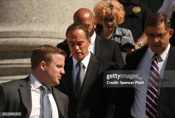 Rep. Chris Collins walks out of a New York court house after being charged with insider trading on August 8, 2018 in New York City. Federal...