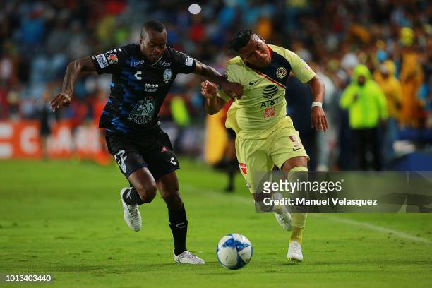 Jaine Barreiro of Pachuca struggles for the ball against Roger Martinez of America during the third round match between Pachuca and Club America as...