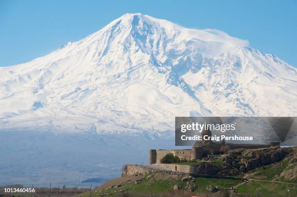snow-covered mt ararat towers above khor virap monastery. - armenian church stock pictures, royalty-free photos & images