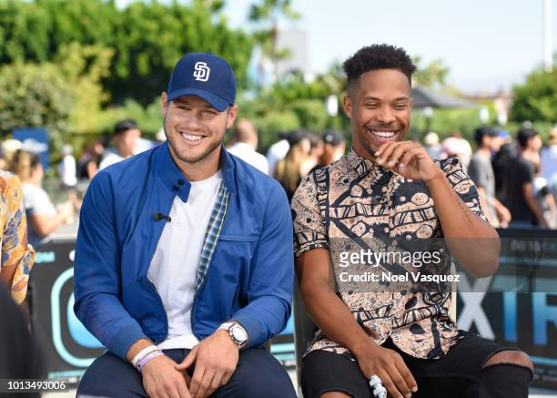 Colton Underwood and Wills Reid visit "Extra" at Universal Studios Hollywood on August 8, 2018 in Universal City, California.