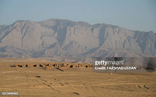 This photo taken on July 19, 2018 shows a general view of Sakhi village in the middle of Shadyan dessert on the outskirts of Mazar-i-Sharif. - A 70...