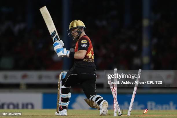 In this handout image provided by CPL T20, Brendon McCullum of Trinbago Knight Riders is bowled by Kieron Pollard of St Lucia Stars during the Hero...