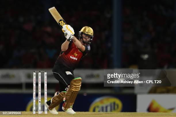 In this handout image provided by CPL T20, Colin Munro of Trinbago Knight Riders hits the ball down the ground during the Hero Caribbean Premier...