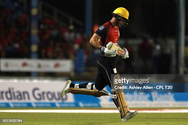 In this handout image provided by CPL T20, Chris Lynn of Trinbago Knight Riders goes out to bat during the Hero Caribbean Premier League match...