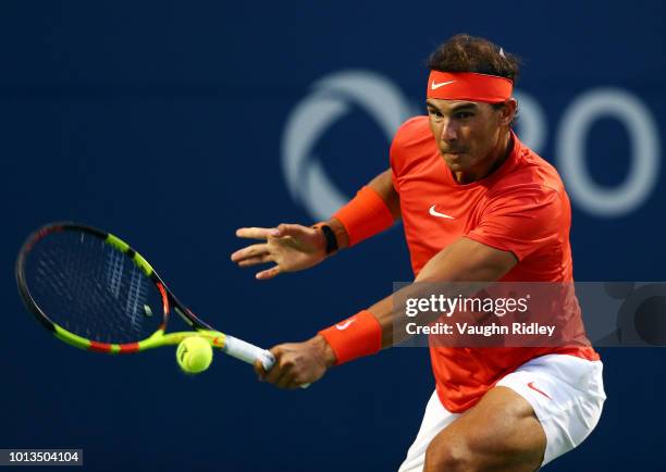 Rafael Nadal of Spain plays a shot against Benoit Paire of France during a 2nd round match on Day 3 of the Rogers Cup at Aviva Centre on August 8,...