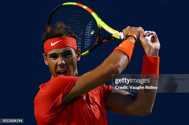 Rafael Nadal of Spain plays a shot against Benoit Paire of France during a 2nd round match on Day 3 of the Rogers Cup at Aviva Centre on August 8,...