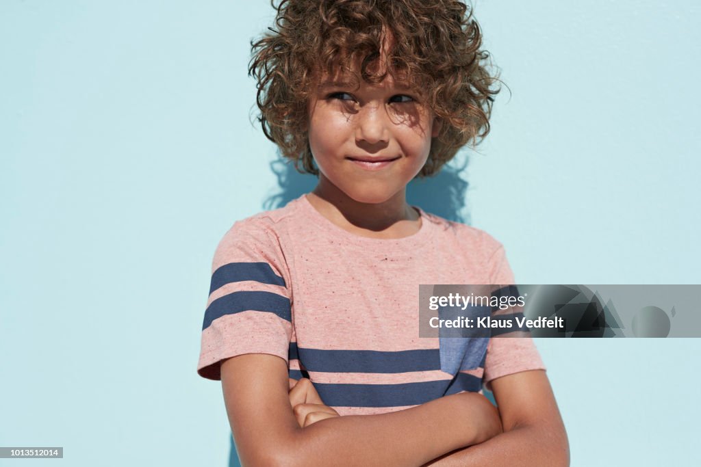 Portrait of cool boy looking in camera and smiling